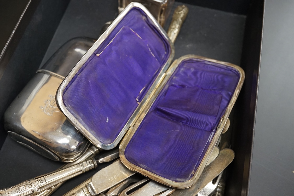 A late Victorian silver mounted glass hip flask, James Dixon & Sons, Sheffield, 1891, 15.5cm (lead solder), together with a silver mounted glass inkwell, assorted silver handled plated dessert eaters(a.f.) and a tortoise